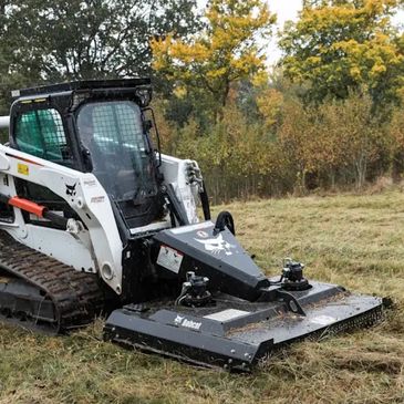 Bobcat CTL and Bobcat Brush Cat servicing a pasture