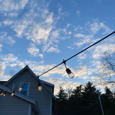 Gorgeous blue skies from the backyard with string lights