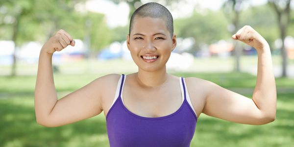Healthy strong muscular asian woman at Druid Hill Park in Baltimore Maryland
