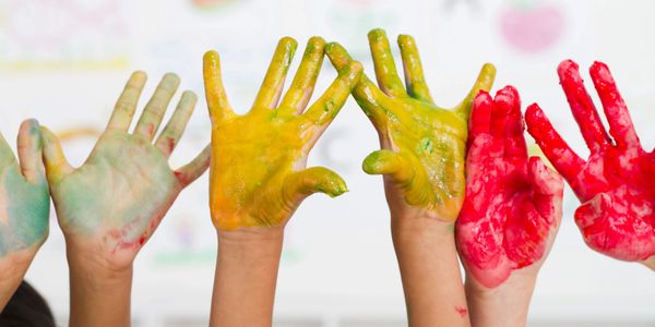 Children's hands covered with paint