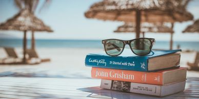 Books on a table at the beach
