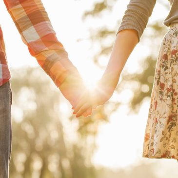 Married Couple's Review Image, Couple Holding Hands with sun shining through