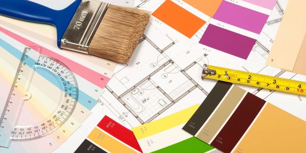 House plans with a paint brush and paint swatches