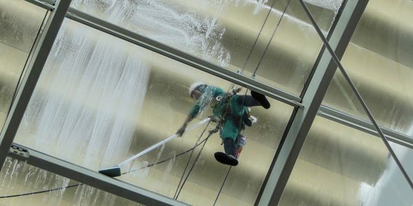 Our employee cleaning commercial windows