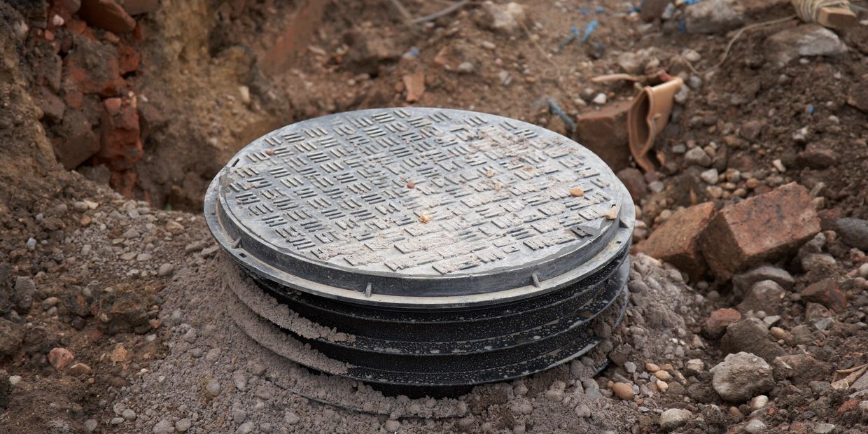 Expose septic tank for inspection