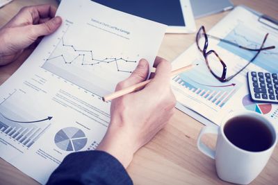 Loan processing expert reviewing graphs