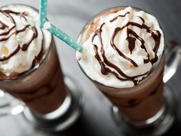 Chocolate frappes with whipped cream and chocolate drizzle