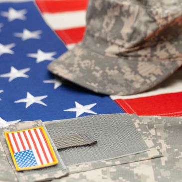 A US flag and a veteran uniform set