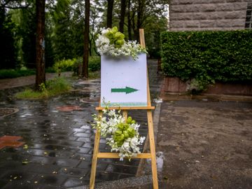 wedding rehearsal sign pointing directions