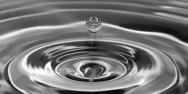 A droplet of water creates a ripple effect