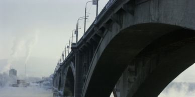 Multiple spans of a bridge above a river.