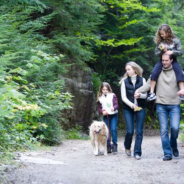 Family in the woods on walk for better health.