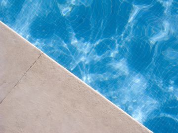 Cristal blue swimming pool and edge of pool
