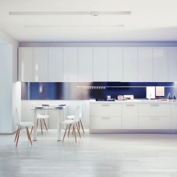A white-themed kitchen and furniture