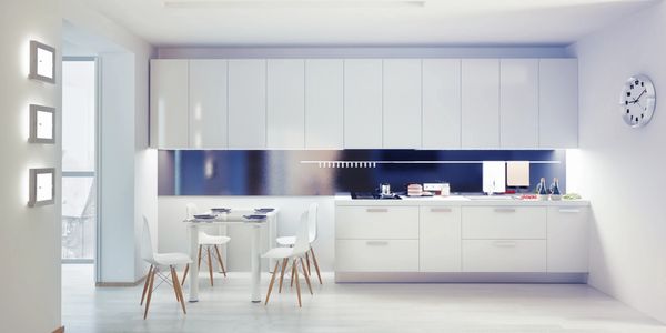 modern European white kitchen cabinets with light grey floor and quartz counter top