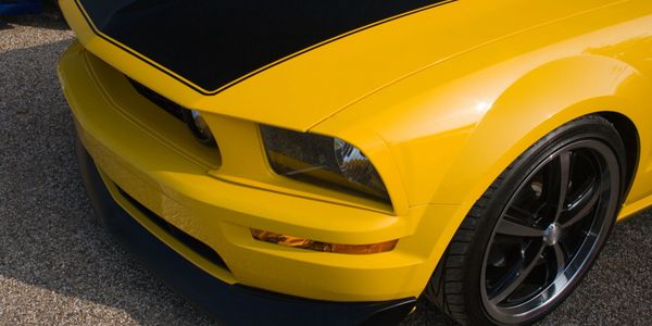 Hood of a yellow and black car
