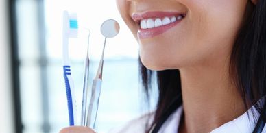 dental examination mirror and toothbrush