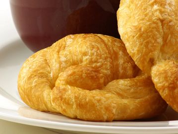 Warm buttery and savory freshly baked croissant