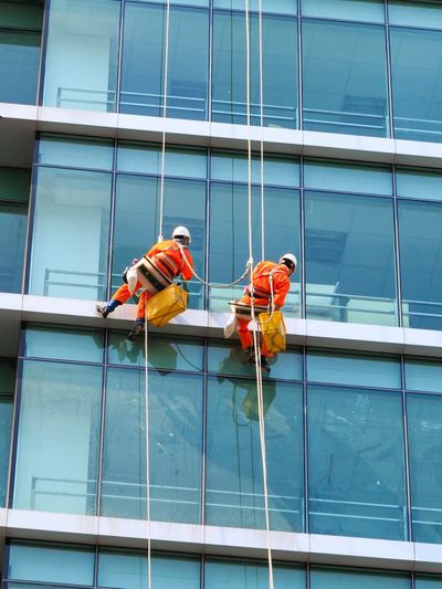 cleaning the windows of the office building