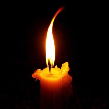 Close-up of a single candle flame