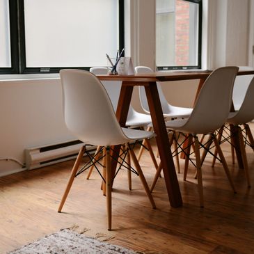 A six-seater table near the window