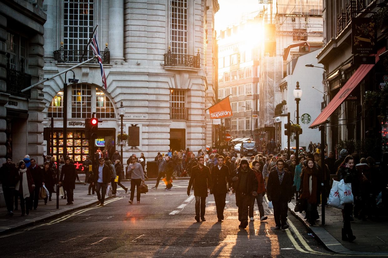 People walking in a crowded London street.