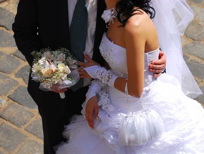 bride and groom embracing 
