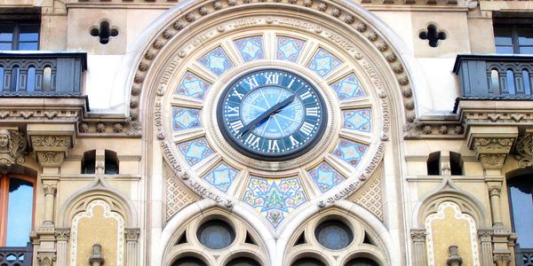 large outdoor clock set in european building. www.rsivacations.com