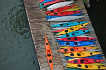 Red Oar Writing kayaks on a boat dock