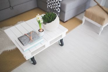A well designed white wooden table with different items