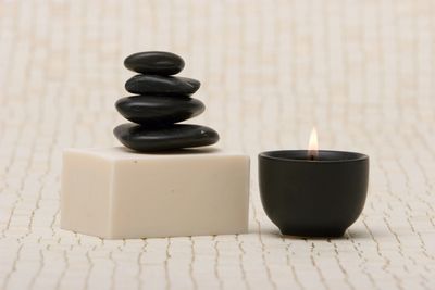 Balancing rocks with a lighted candle