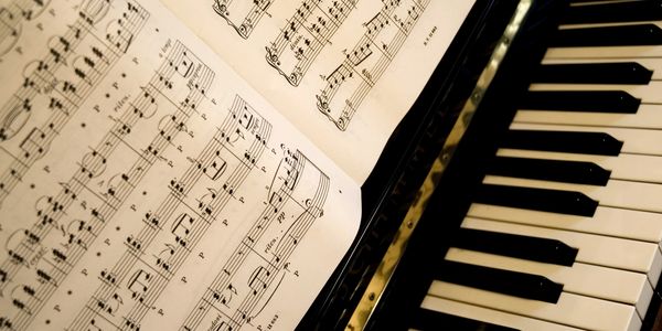 sheet music and piano keys