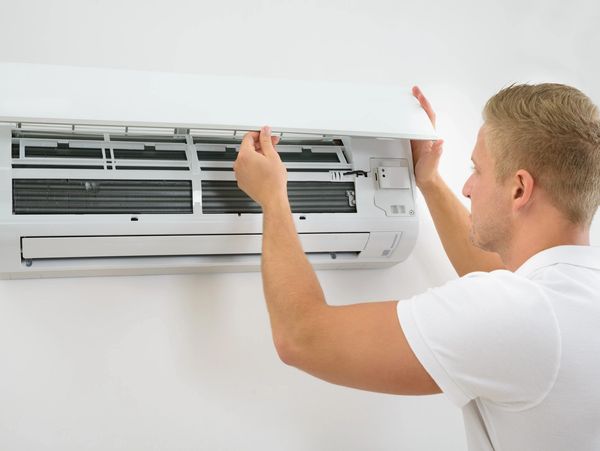 man setting up the air conditioner