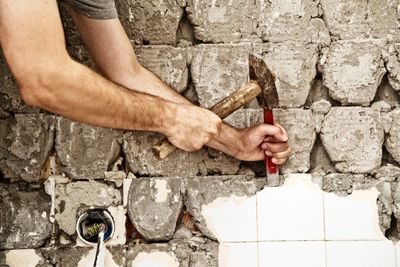 Removing tiling to remedy dry rot