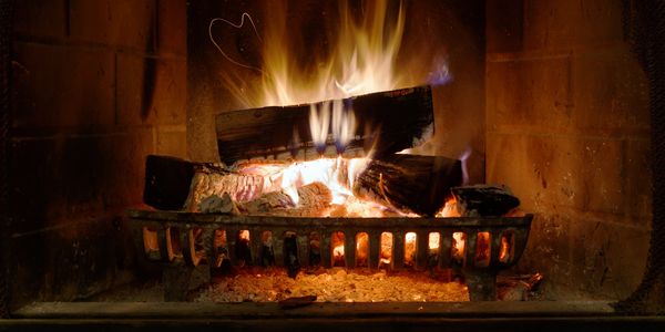 wood burning fireplace
dry firewood
hot, cozy fire