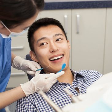 Young man in treatment chair at dentist