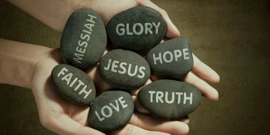 Rocks with Jesus, hope, love, faith truth printed on them