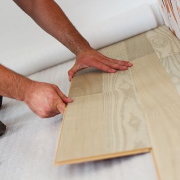 vinyl plank flooring being installed