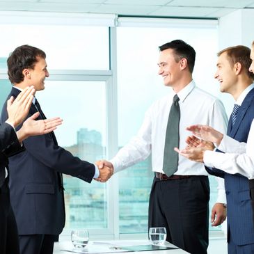 People shaking hands on a closed business deal