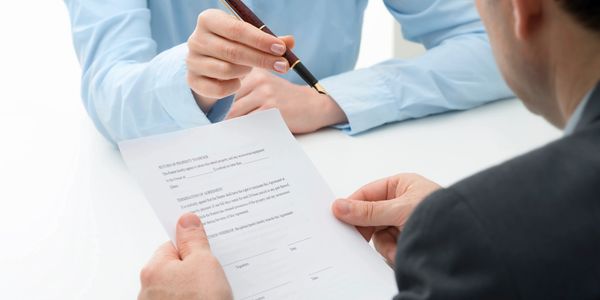 Broker getting a client to sign a document