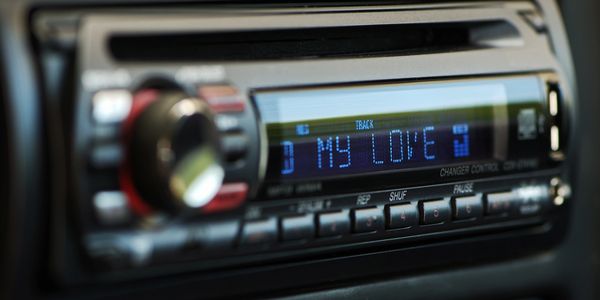 Face plate of a custom stereo with word that spell out "My Love" on the display. 