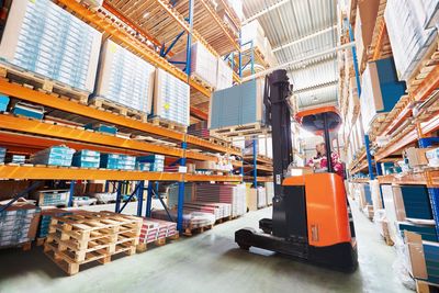 Reach truck operating in racking