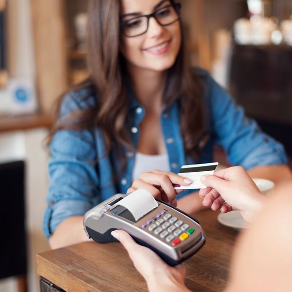 Customer Handing Credit Card to Employee