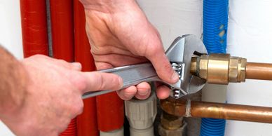 Using plumbing tools and wrenches for repairs