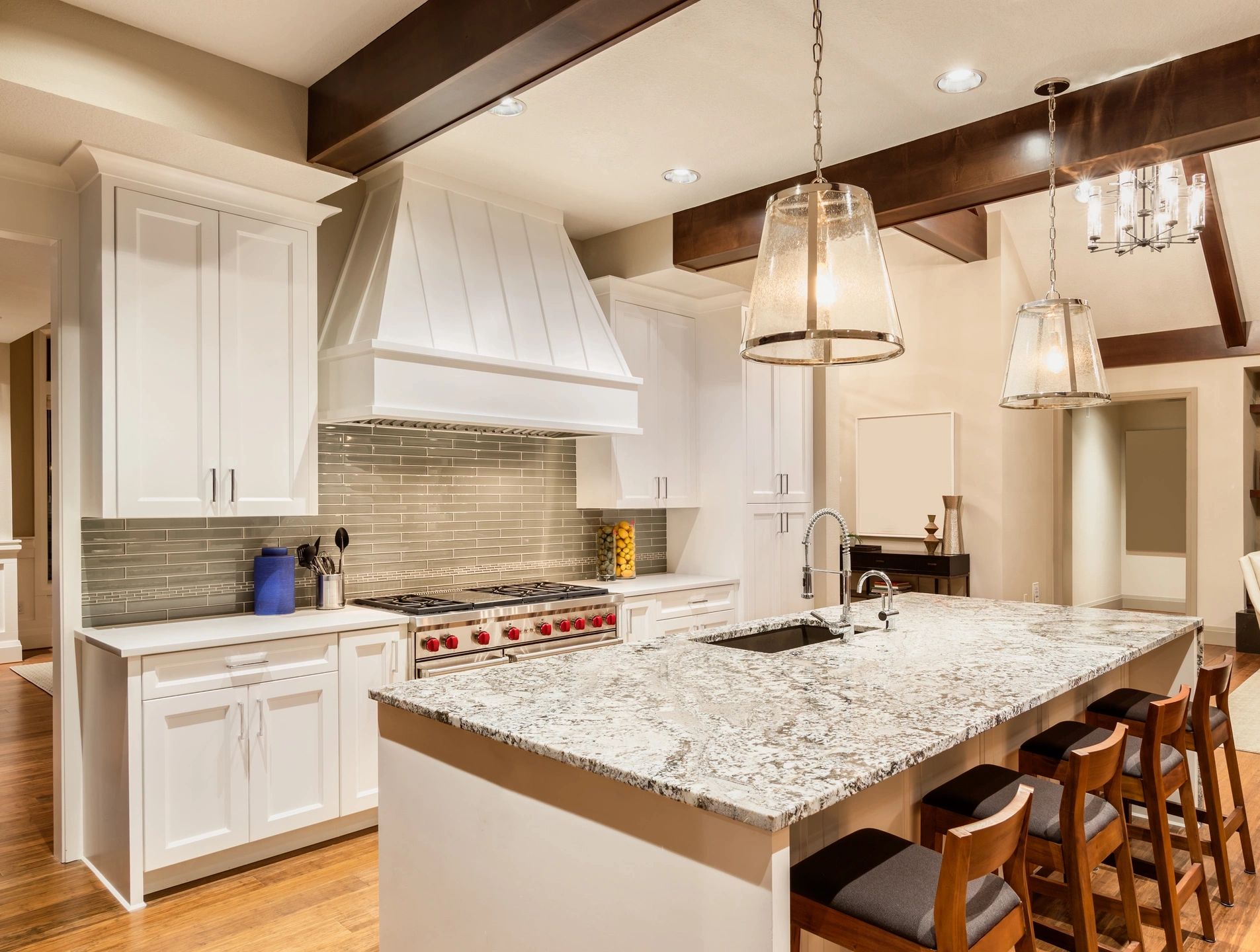 Kitchen renovation with new backsplash tile, cabinets, counter tops and hardwood floor