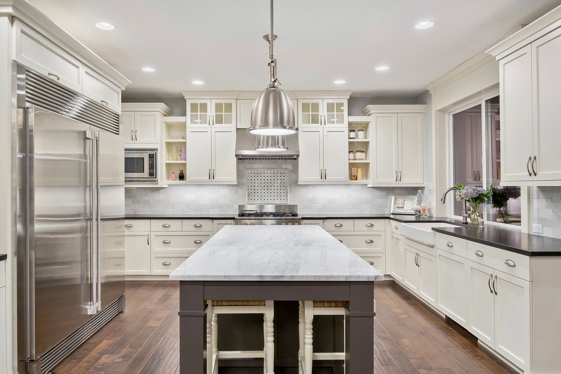 Contrasting stone countertops. Dark and light stone adds drama and sophistication to any kitchen.