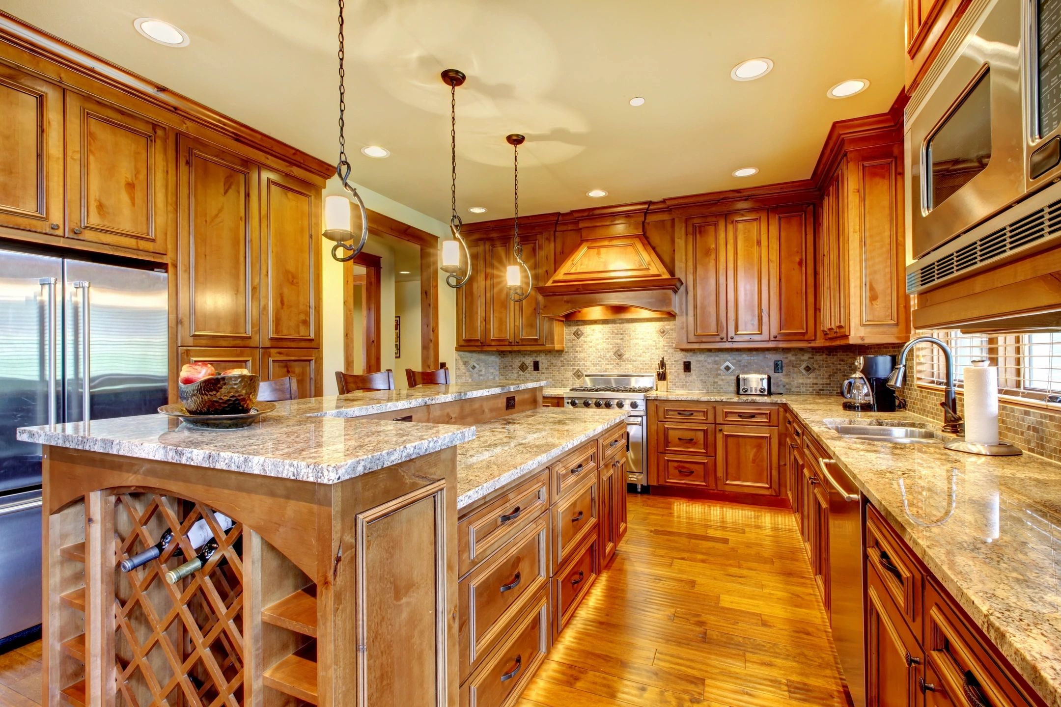 Kitchen with custom cabinets,granite countertops and stainless steel appliances.