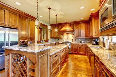 Large kitchen with warm wood honey tones.