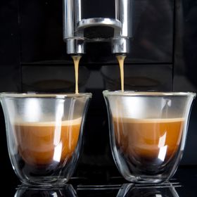 Two cups of expresso being made