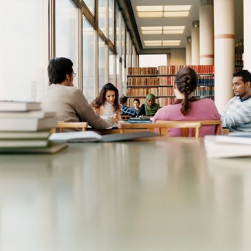 College students sitting at a library table